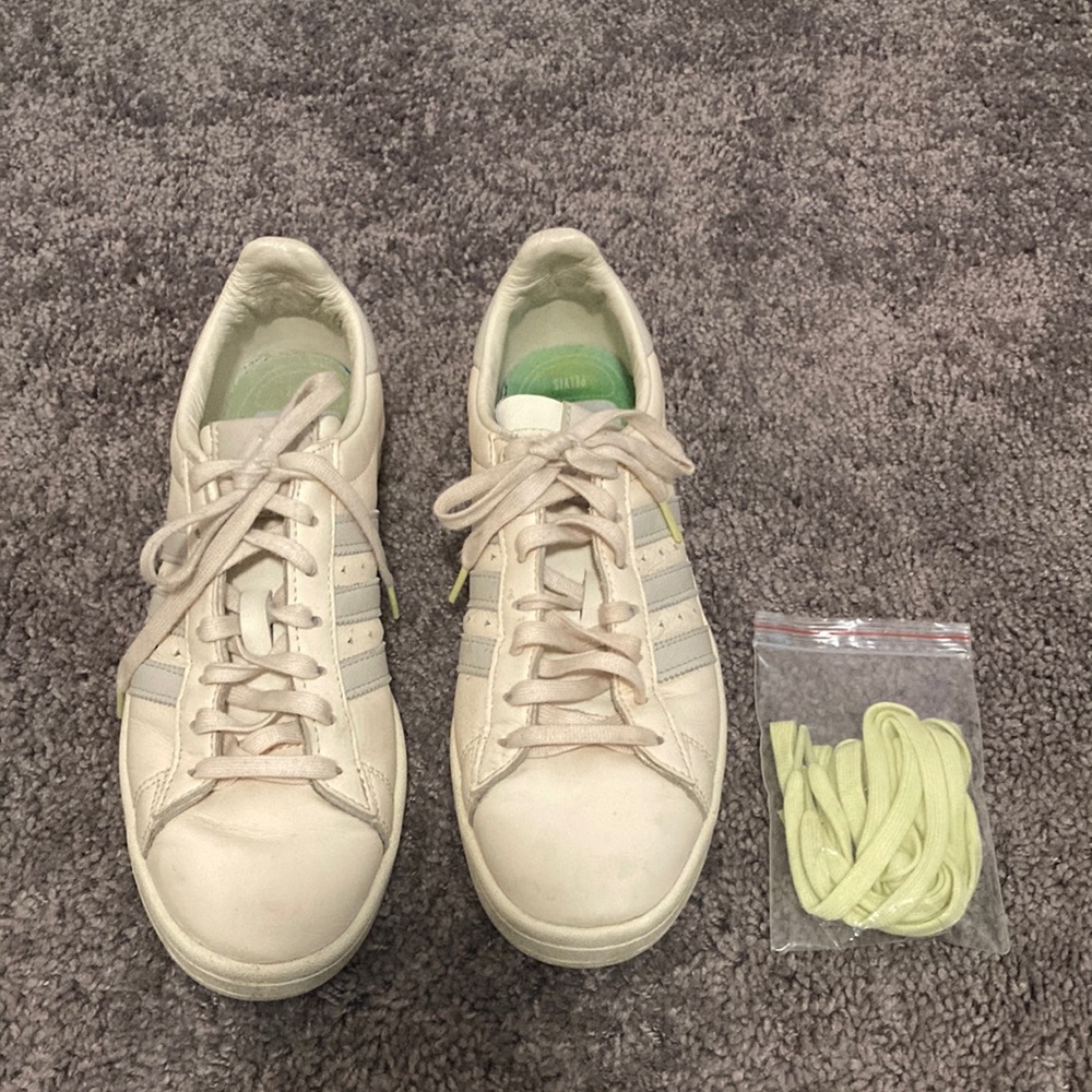 White and grey Adidas sneakers with extra set of laces